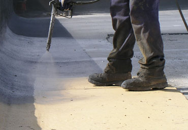 Coating systems over Cincinnati spray foam roof systems